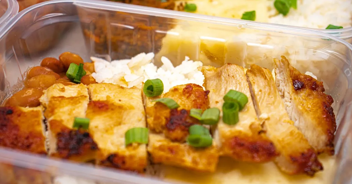 A variety of colorful freezer meals neatly arranged in a chest freezer, with labels clearly visible