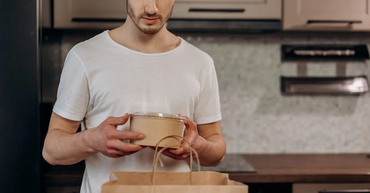 A neatly organized freezer drawer filled with labeled freezer bags and glass containers of various meals, representing easy freezer meals for busy moms.