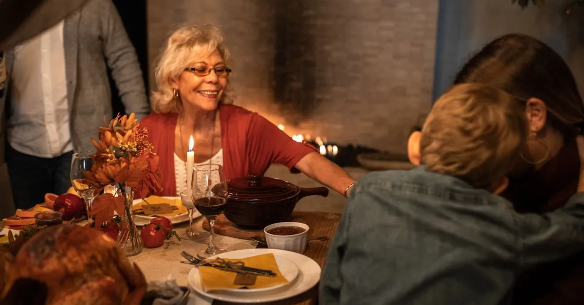 Pinterest-ready image: Happy families celebrating Friendsgiving with kids, featuring a festive table, fall decor, and children engaged in activities. Ideal for 'Kid-Friendly Friendsgiving Ideas'.