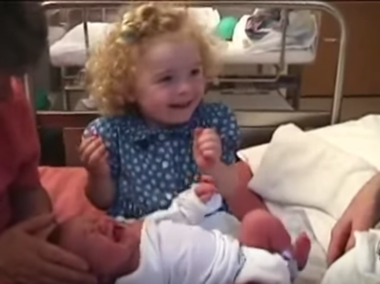 Big Sister Calms Baby Sister in the Sweetest Way